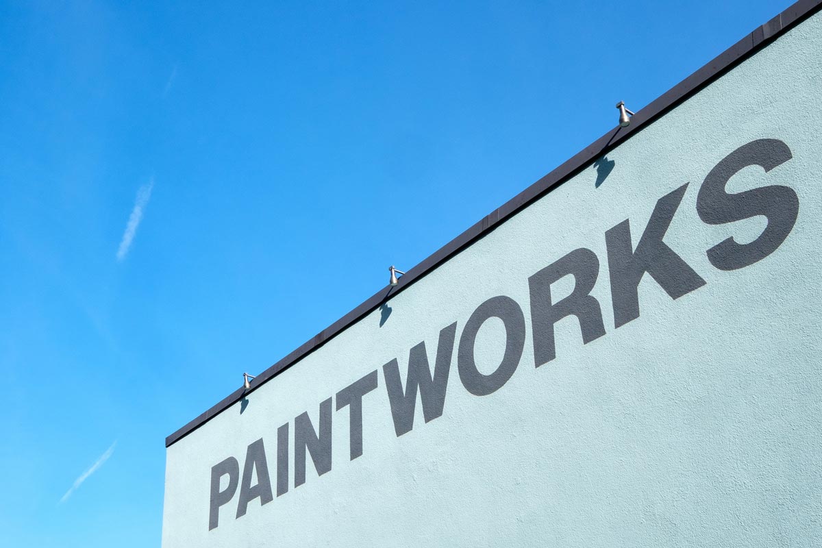 Paintworks painted on side of building at entrance to 