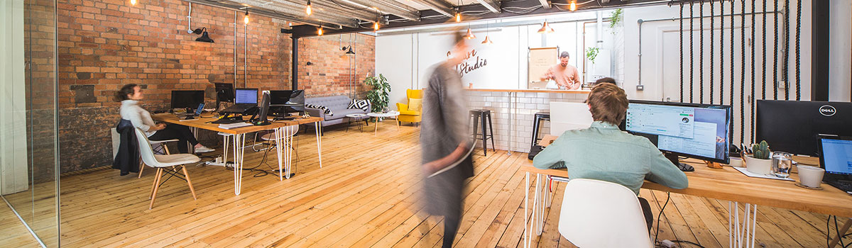 Studio office with exposed brickwork and glazed partition