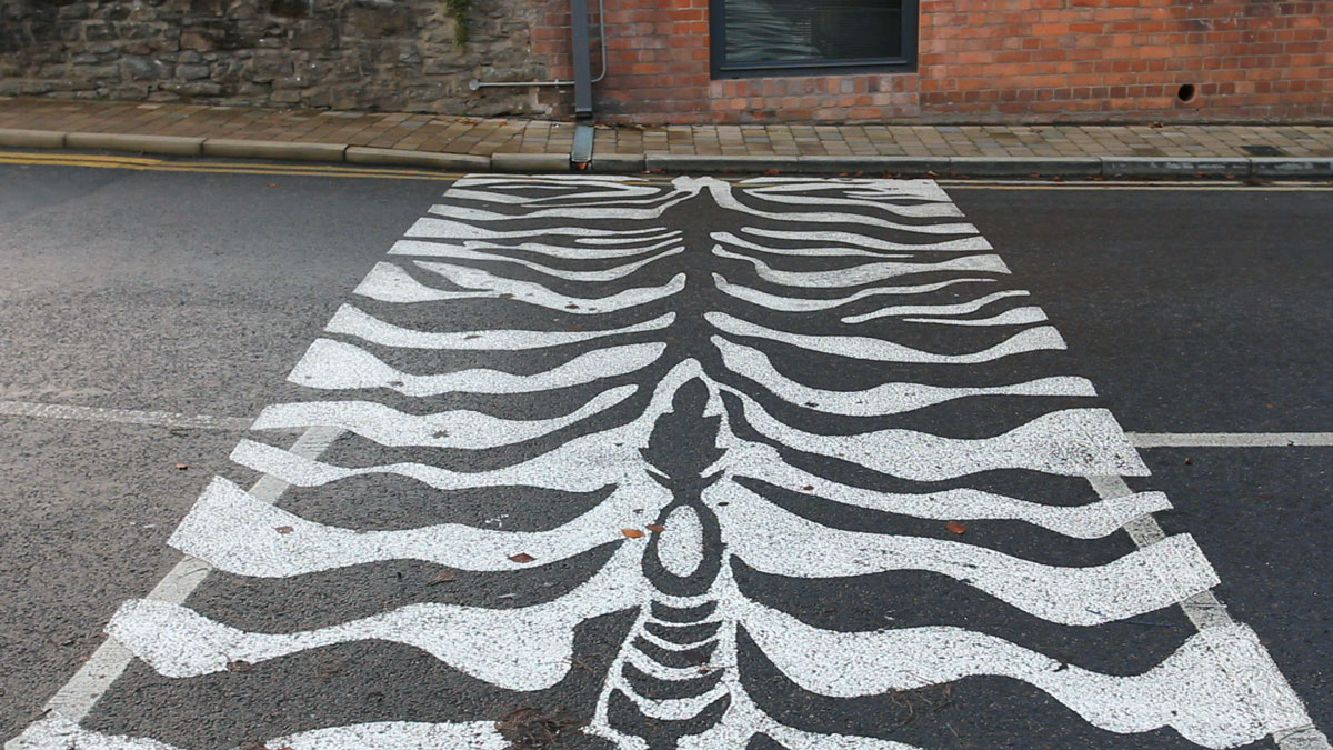 Zebra crossing painted to resemble zebra stripes